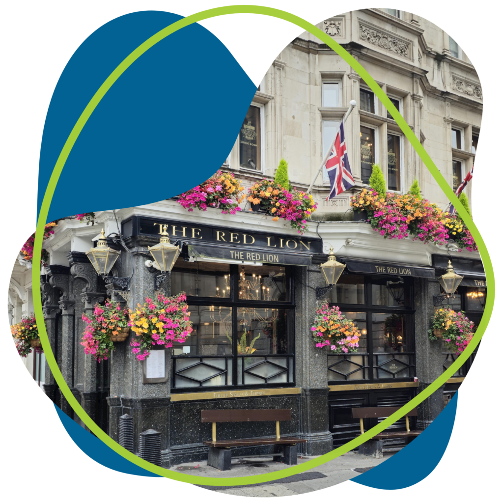 A picture of a pub in London with union jack flags and flowers added to a shape with Capify colours in it